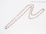rosary necklace with amethorate beads on a white background