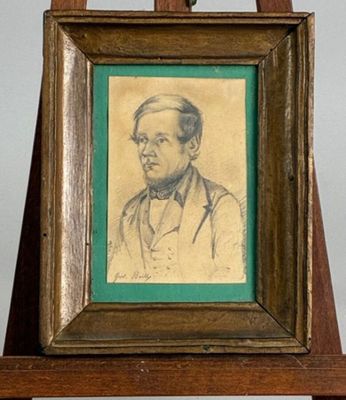 painting of a man in a suit and tie in a wooden frame