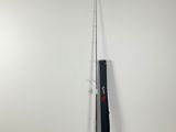 a black and white pole next to a white wall
