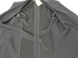 the back of a jacket with a zipper on a white background