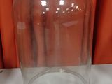 a large glass jar with a glass lid on a table