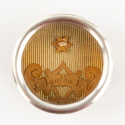 a silver ring with a picture of a man and a woman on it