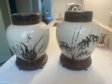 two vases that are sitting on a counter