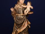 a statue of a woman holding a baby in her arms