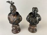 pair of bronze busts of a man and a woman