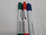 three pens that are sitting next to each other on a table