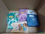 a box with a variety of diapers and diapers in it