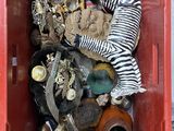 a red box filled with assorted items and a zebra