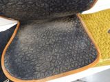 a close up of a seat cushion on a bench