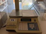 a calculator sitting on a table in front of a window