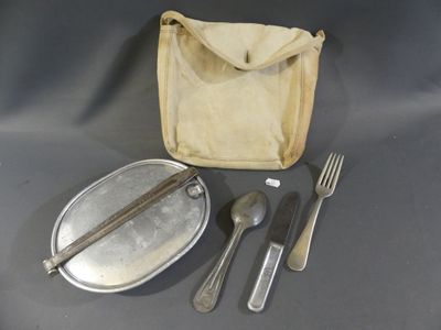 a silverware set on a table with a bag