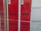 two red lockers stacked on pallets next to each other