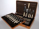 a suitcase that has a set of knives and knives in it