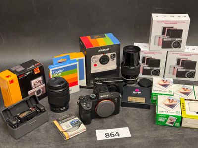 many different cameras and cameras that are sitting on a table