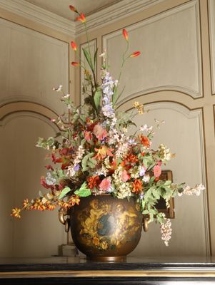 a vase of flowers sitting on top of a table