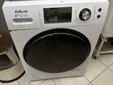 an image of a white washing machine in a kitchen