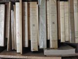 a lot of books that are sitting on a shelf