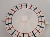 a white bowl with a red and blue design on it