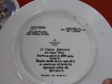 a plate with a poem on it sitting on a table