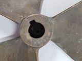 a close up of a metal propeller wheel with a hole in the center