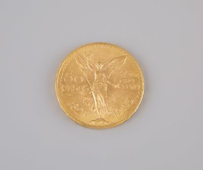 a gold coin with a picture of a woman on it