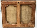 an old wooden picture frame with a burlock cloth backing