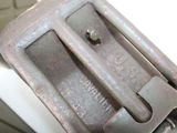a close up of a metal buckle on a motorcycle
