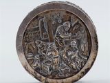 an antique silver plate with a scene of a man and a woman in a kitchen