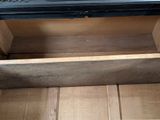a wooden box with a laptop on top of it