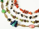 an image of a multi - stranded necklace with multi colored beads