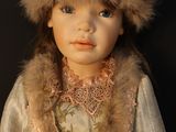 a doll that is wearing a fur hat on a black background