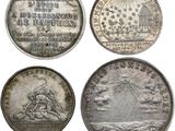 four different types of silver coins on a white background