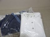 three pairs of men ' s shirts wrapped in plastic