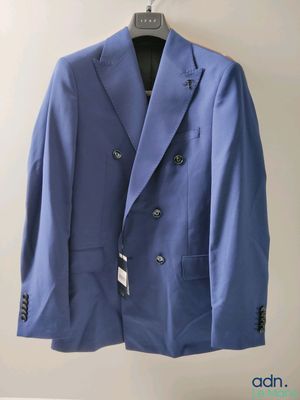 blue suit hanging on a hanger in a room