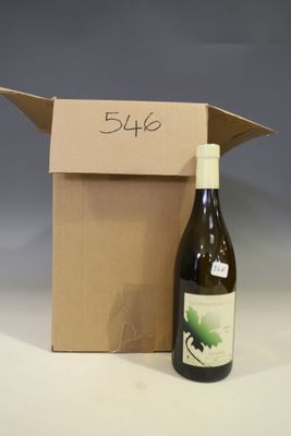 a bottle of wine sitting next to a cardboard box