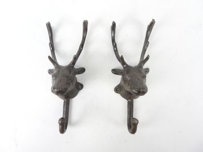 pair of antique cast iron deer head hooks