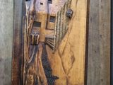 a picture of a wooden plaque with a bird on it