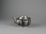 an old silver teapot with a handle and a lid