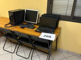 a desk with two computers and a laptop on it