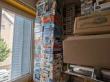 boxes stacked on top of each other in a room next to a window