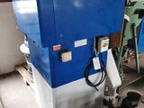 a blue machine that is sitting in a room