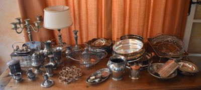 a table with a lot of silver items on it