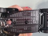 a person holding a remote control car in their hand