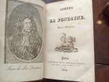 an open book with a picture of a man and a woman on it