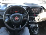 the interior of a car with a steering wheel and dashboard controls