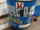two buckets of paint sitting on top of a wooden pallet
