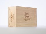 a wooden box with a label on it sitting on a table