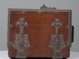 a wooden chest with ornate carvings on it