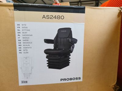 a cardboard box with a picture of a car seat in it