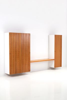 an image of a white and wood bench in a white room